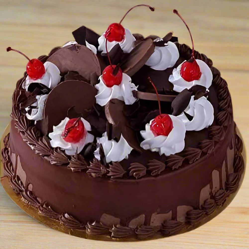 Creamy Chocolate Cake — chocolate-coloured cream swirls and white-and-red topping accents; India