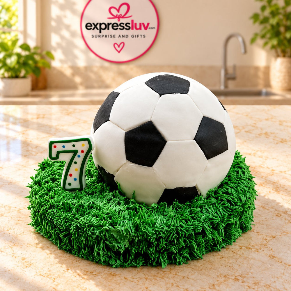 Football Cake — a black-and-white football on a green textured base; India