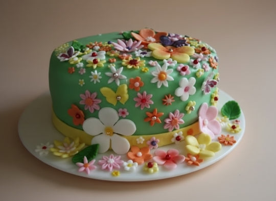 Beauty Flower Cake 1 kg — green finish covered in colourful flowers; India