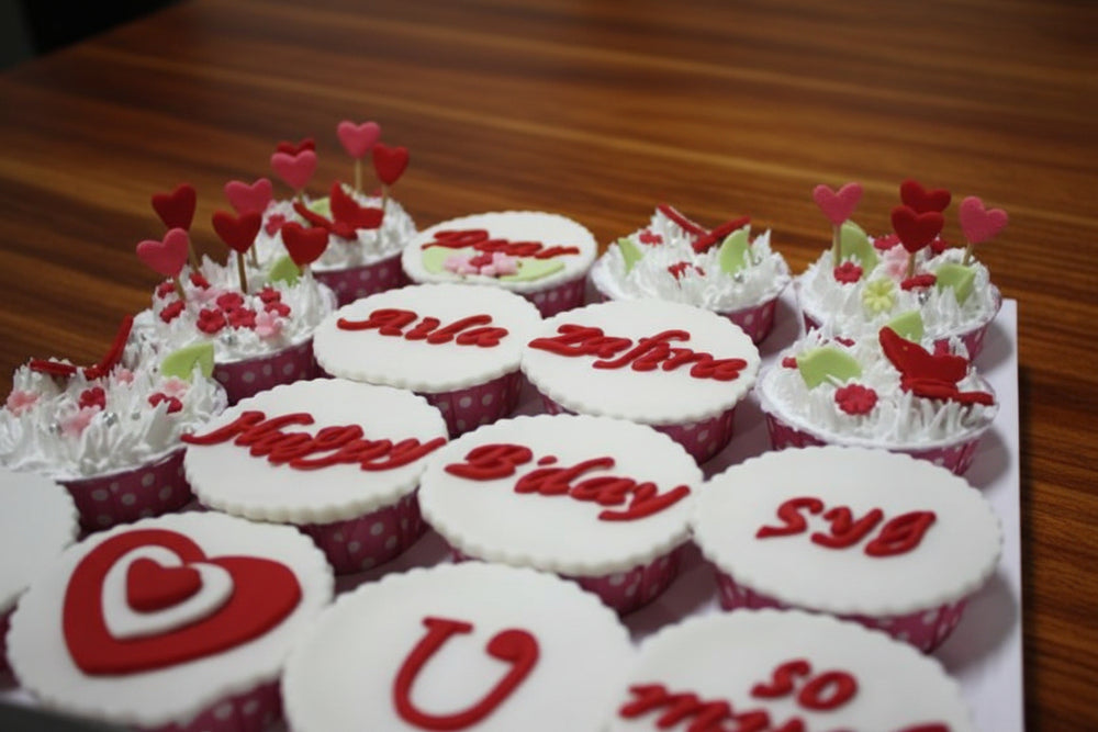 I Love You Cupcakes — red-and-white love-themed lettering on individual cupcakes; India