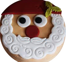 Santa Face Cake — a Santa face with white beard and red hat; India