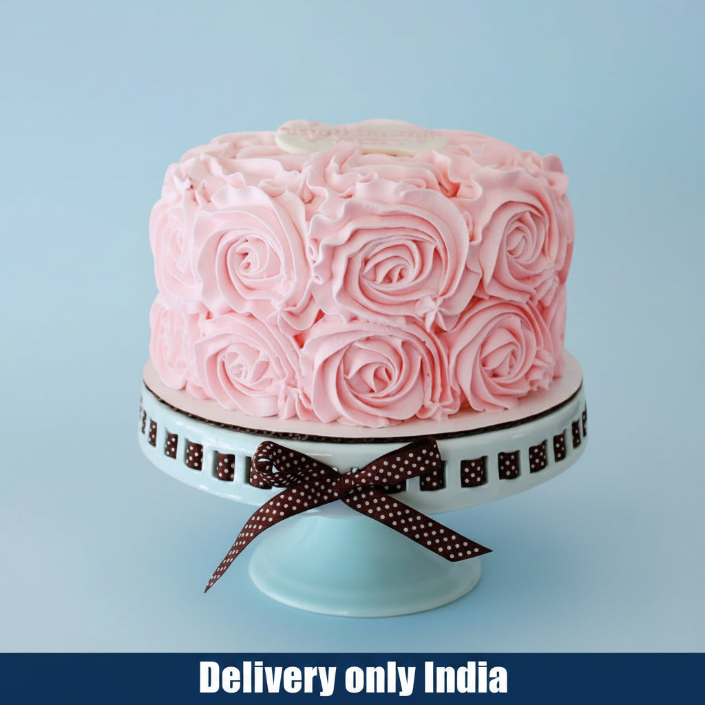 Pink Flower Cake — pink rose-style piping and dark bow edging; India