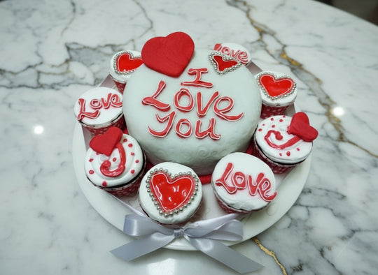 Love Cake and Cupcake Set — a central heart-themed cake surrounded by decorated cupcakes; India