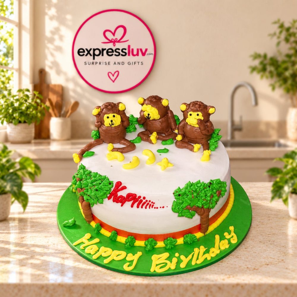 Three Monkey Cake design, photographed on a sunlit marble counter — delivery in India