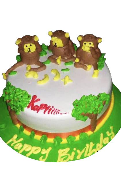 Three Monkey Cake — three monkey figures and green garden-themed detailing; India