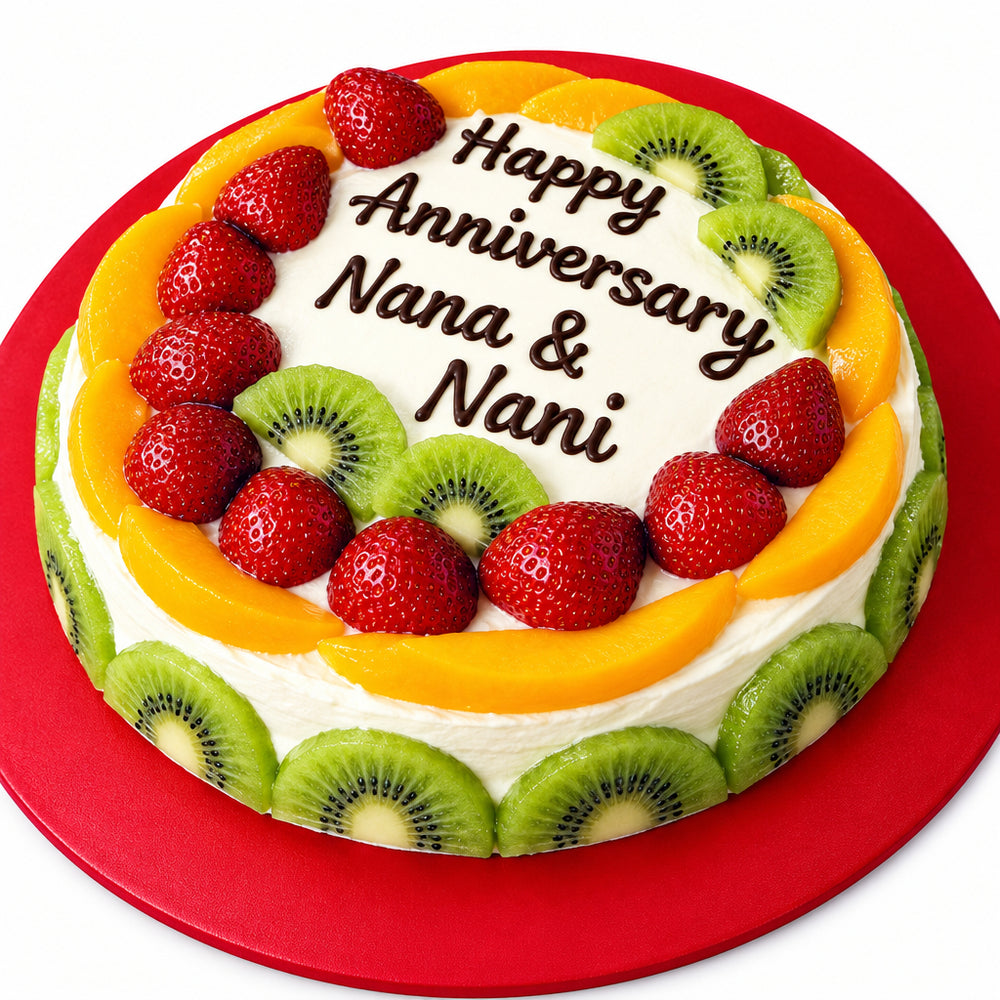 Fruit Delight Cake — orange-coloured fruit border, strawberries and kiwi slices; India