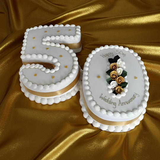 Happy 50th Wedding Anniversary Cake — a white-and-gold number 50 design; India