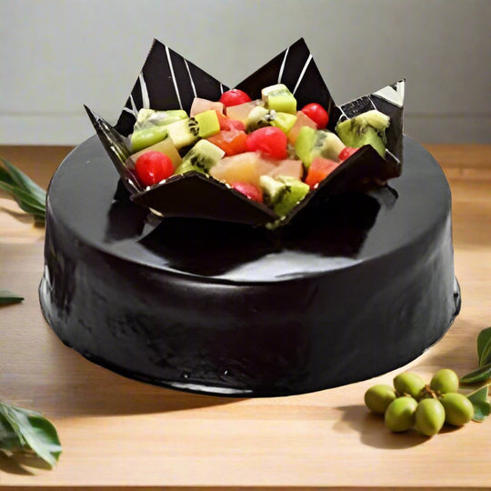 Chocolate Fruit Cake — dark smooth finish and a mixed-fruit centre with pointed panels; India