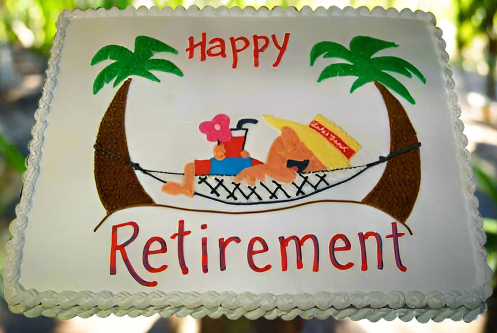 Holiday Theme Retirement Cake — palm-tree decorations and a retirement holiday motif; India