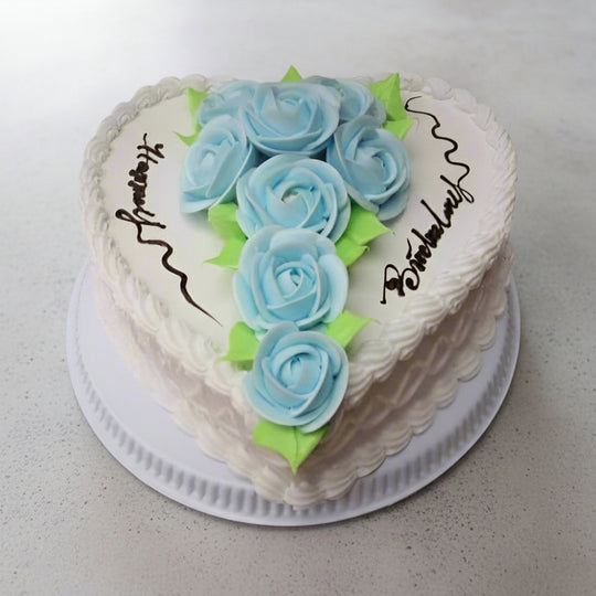 Rose Decor Heart-Shaped Cake — white finish and cascading pale blue roses; India