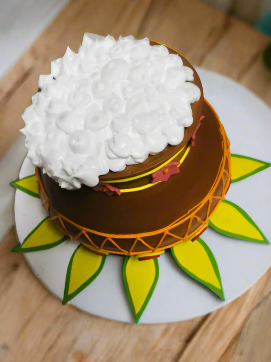 Pongal Theme Cake — brown pot design with a white textured topping; India