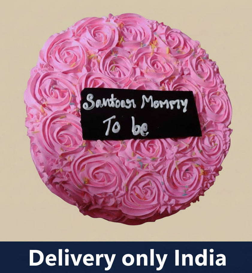 Mother-to-Be Celebration Cake — pink rose-style piping and a mother-to-be message panel; India