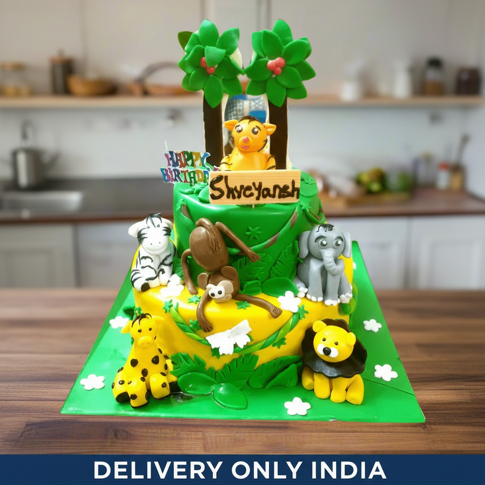 Celebration Animal Theme Cake — green jungle scene with animal figures and palm decorations; India