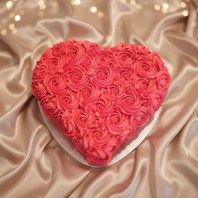 Heart Design Red Roses Cake — dense red rose-style cream piping; India