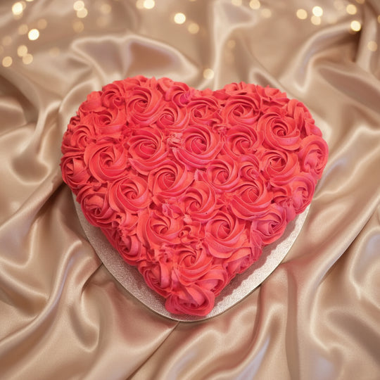 Heart Design Red Roses Cake — dense red rose-style cream piping; India