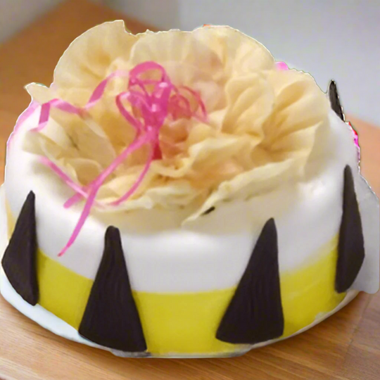 Pineapple Cake for Birthday — white-and-yellow finish with pale flower-style topping; India