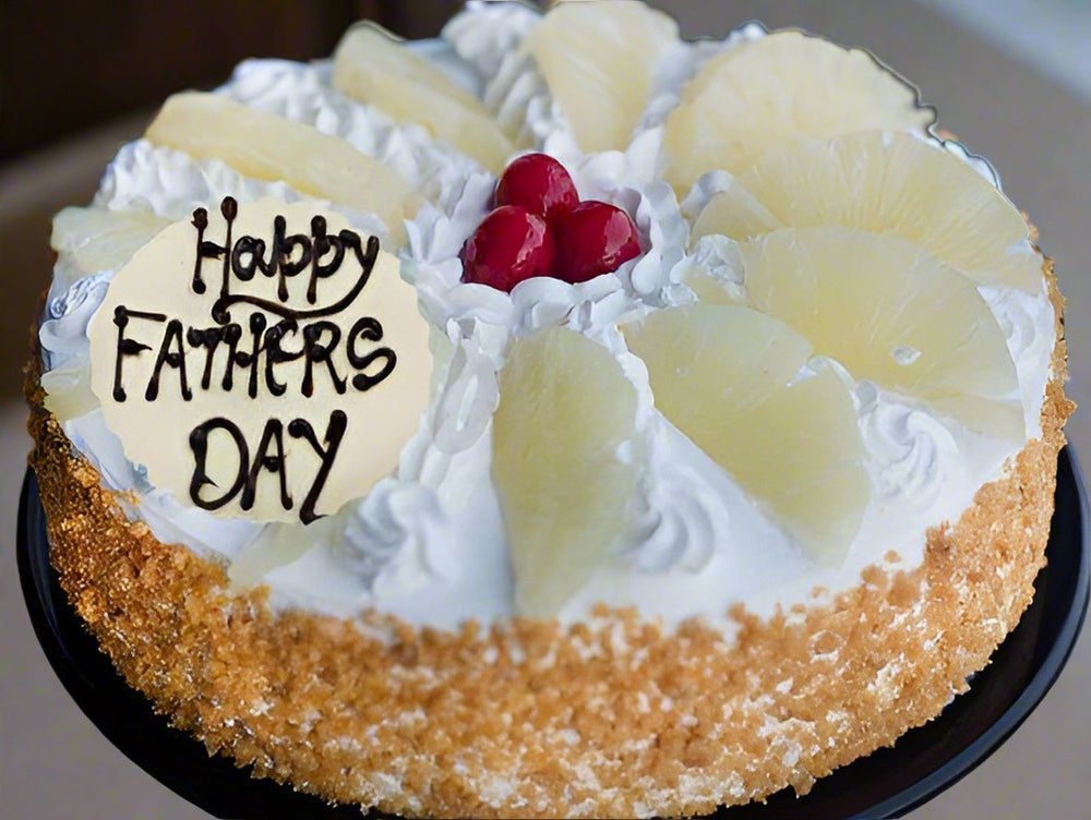 Cheers Dad Cake — golden crumb sides, pale cream topping and dad greeting; India