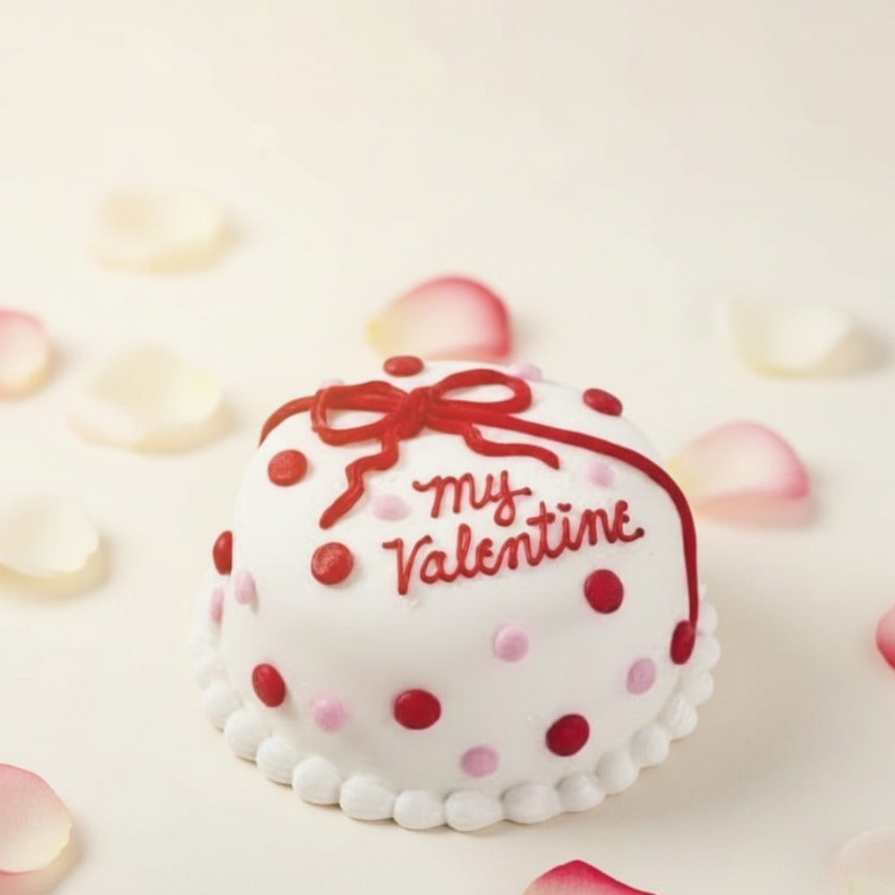 My Valentine Cake — white finish, red bow and a Valentine's greeting; India